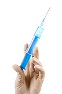 small close up of lab worker hand holding syringe before making injection SBI 300908667