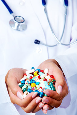 smaller pills in human hands SBI 300905791